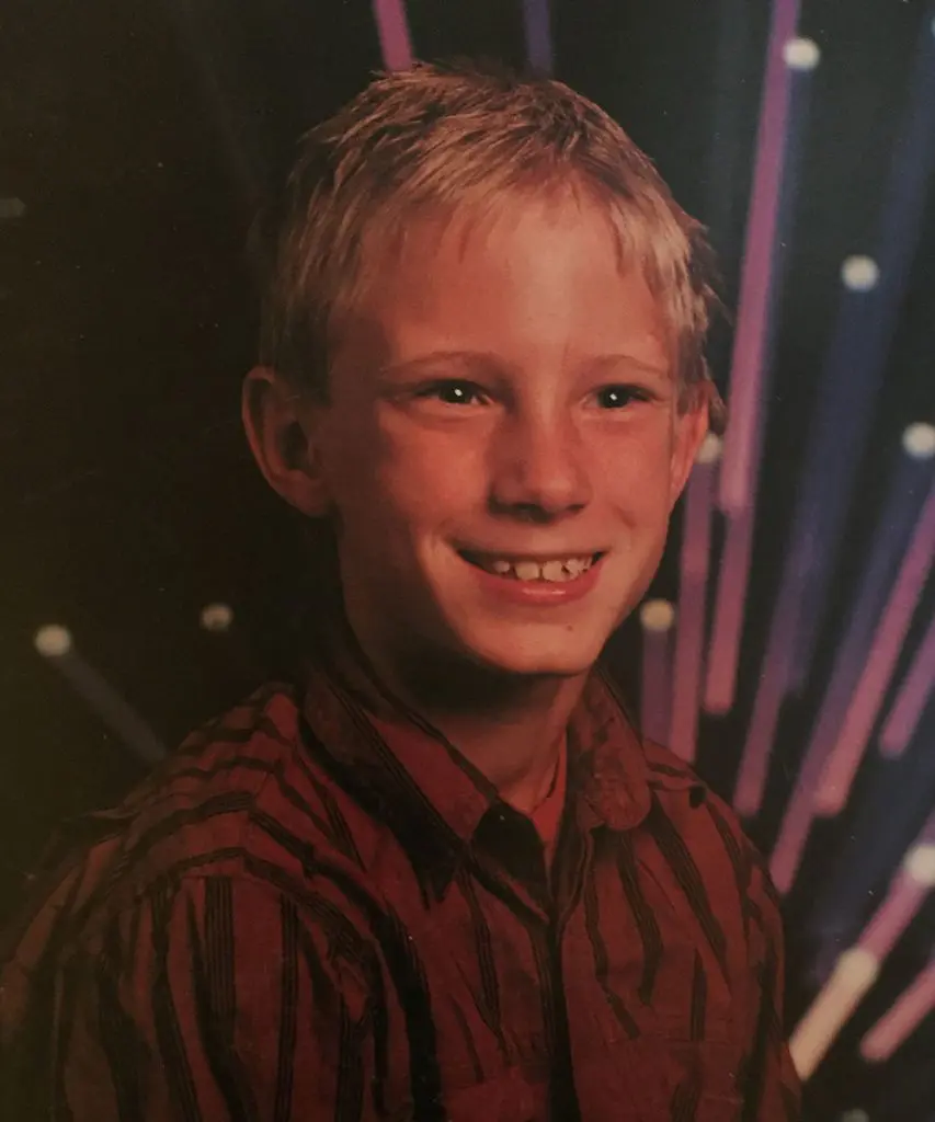 Smiling boy with colorful light background